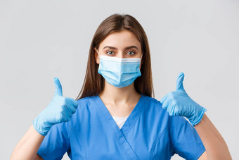 科维德防止病毒健康医疗保健工人检疫概念特写镜头支持女护士医生蓝色的实习医生风云医疗面具手套竖起大拇指批准