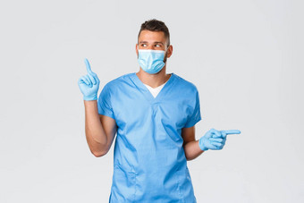 医疗保健工人科维德冠状病毒防止病毒概念英俊的微笑医生护士蓝色的实习医生风云医疗面具手套指出左变体促销产品