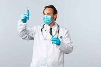 科维德防止病毒医疗保健工人疫苗接种概念专业跟实验室医生医疗面具手套试管冠状病毒疫苗