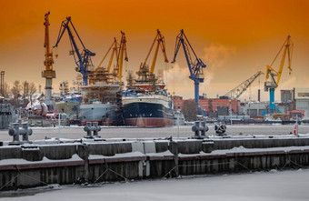 建设核破冰船魔法日落起重机波罗的海船厂冷淡的冬天一天蒸汽neva河光滑的表面河天空橙色颜色