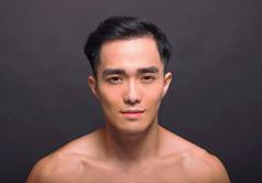 特写镜头亚洲英俊的年轻的男人。脸
