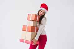 圣诞节假期概念女人圣诞老人他持有堆栈礼物盒子白色背景