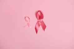 缎粉红色的丝带意识国际象征乳房癌症意识月10月孤立的粉红色的背景复制空间10月粉红色的一天世界癌症一天国家癌症幸存者