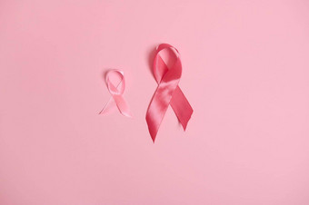 缎粉红色的丝带<strong>意识</strong>国际象征乳房癌症<strong>意识</strong>月10月孤立的粉红色的背景复制空间10月粉红色的一天世界癌症一天国家癌症幸存者