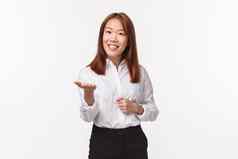 肖像愉快的优雅的亚洲女企业家办公室夫人正式的穿指出手相机微笑会说话的业务合作伙伴会议人站白色背景