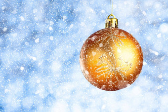 金圣诞节球雪模糊蓝灰色背景复制空间一年问候卡