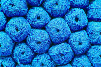 蓝色的球羊毛美丽的彩色的毛球羊毛纹理棉衣,纱自然材料针织有创意的的想法摘要Diy背景