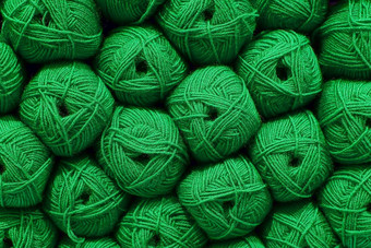 绿色球羊毛美丽的彩色的毛球羊毛纹理棉衣,纱自然材料针织有创意的的想法摘要Diy背景