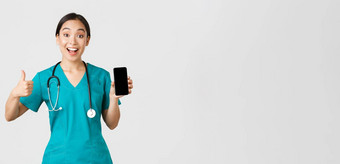 科维德医疗保健工人在线医学概念深刻的印象很高兴亚洲女医生距离咨询方法冠状病毒显示智能手机应用程序竖起大拇指