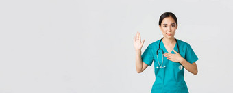 科维德医疗保健工人防止病毒概念微笑诚实的亚洲女医生实习生实习医生风云给承诺提高手臂持有手心承诺誓言病人