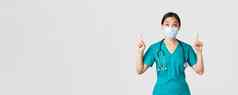 科维德冠状病毒疾病医疗保健工人概念感兴趣兴奋亚洲女人医生护士医疗面具手套指出手指白色背景