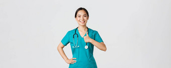 科维德医疗保健工人流感大流行概念微笑乐观的自信女亚洲护士实习医生风云控制显示竖起大拇指批准保证质量服务诊所