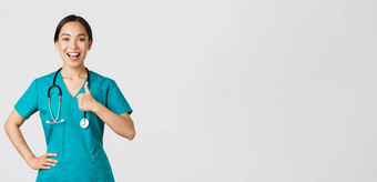 科维德医疗保健工人流感大流行概念微笑乐观的自信女亚洲护士实习医生风云控制显示竖起大拇指批准保证质量服务诊所