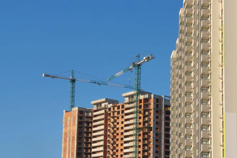 建筑建设背景清晰的蓝色的天空多层房子抵押贷款塔起重机建设网站建筑公司财产投资建筑真正的房地产公寓建设构建