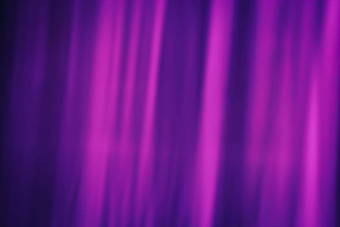 温柔的模糊射线品红色的颜色黑暗紫色的背景抽象窗帘