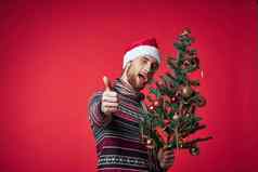 快乐的男人。圣诞老人他圣诞节装饰假期一年红色的背景