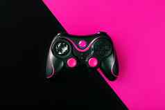 黑色的手柄黑色的粉红色的背景游戏概念设备控制控制游戏