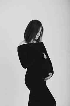 黑色的白色照片怀孕了女人白色背景轮廓