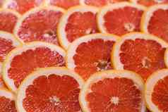 明亮的红色的背景多汁的片葡萄柚健康的食物背景