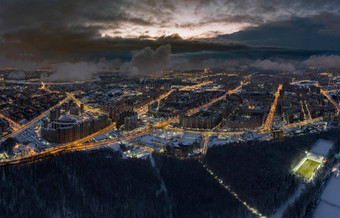 空中冬天城市景观彼得堡俄罗斯黄昏无人机苍蝇巨大的住房地产公共公园建设起重机晚上照明云浮动无人机
