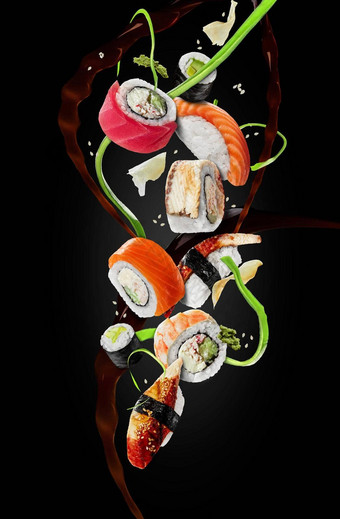 各种各样的寿司<strong>配菜</strong>徘徊空气黑色的背景