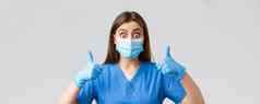 科维德防止病毒健康医疗保健工人检疫概念惊讶兴奋女护士医生完全批准的想法竖起大拇指计划穿医疗面具