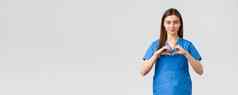 医疗保健工人防止病毒保险医学概念微笑有吸引力的女医生护士蓝色的实习医生风云保持安全首页显示心标志表达尊重冠状病毒战士