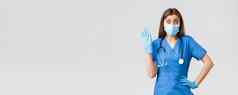 科维德防止病毒健康医疗保健工人检疫概念惊讶可爱的女护士蓝色的实习医生风云诊所波穿医疗面具手套