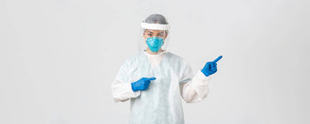 科维德冠状病毒疾病医疗保健工人概念专业女医生科技实验室员工个人保护设备指出手指显示白色背景