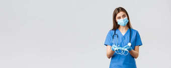 科维德防止病毒健康医疗保健工人检疫概念有吸引力的女护士蓝色的实习医生风云个人保护设备给医疗面具病人