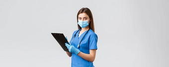 科维德防止病毒健康医疗保健工人检疫概念专业女护士医生蓝色的实习医生风云医疗面具手套写作病人信息剪贴板