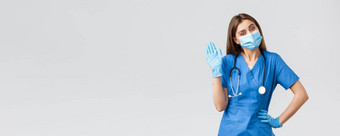 科维德防止病毒健康医疗保健工人检疫概念友好的女护士诊所穿蓝色的实习医生风云医疗面具挥舞着标志手套