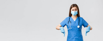 科维德防止病毒健康医疗保健工人检疫概念持怀疑态度不确定女护士医生蓝色的实习医生风云个人保护设备指出手指不确定