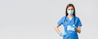 科维德防止病毒健康医疗保健工人检疫概念年轻的医生女护士蓝色的实习医生风云保护设备冠状病毒感染给医疗面具