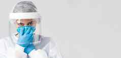 科维德防止病毒健康医疗保健工人检疫概念特写镜头女医生护士个人保护设备把呼吸器相机确定
