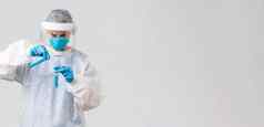 科维德医疗研究医疗保健工人检疫概念科技实验室医生诊所工作冠状病毒疫苗倒液体试管穿个人保护服装