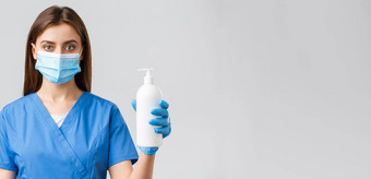 科维德防止病毒健康医疗保健工人检疫概念严肃的表情医疗工人护士医生蓝色的实习医生风云医疗面具显示手洗手液肥皂
