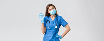 科维德防止病毒健康医疗保健工人检疫概念友好的女护士诊所穿蓝色的实习医生风云医疗面具挥舞着标志手套