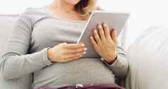 设备使伟大的怀孕规划师拍摄认不出来怀孕了女人平板电脑首页