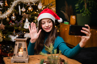 十几岁的女孩使祝愿<strong>视频</strong>会议调用圣诞节
