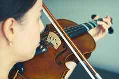 女人玩小提琴音乐音乐家小提琴家显示字符串肖像太阳