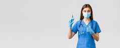 科维德防止病毒健康医疗保健工人检疫概念女护士医生蓝色的实习医生风云医疗面具指出注射器冠状病毒疫苗