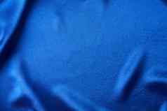 蓝色的丝绸背景折叠摘要纹理波及缎表面