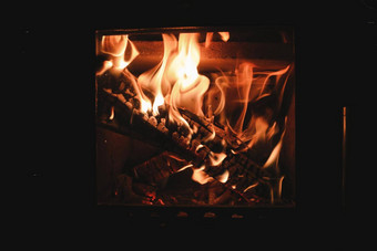 明亮的<strong>彩色</strong>的跳舞<strong>火焰</strong>壁炉关闭燃烧柴火舒适的温暖的背景