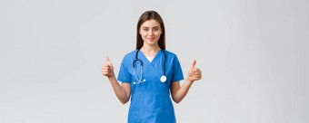 医疗保健工人防止病毒保险医学概念支持专业女护士医生蓝色的实习医生风云听诊器显示竖起大拇指批准微笑