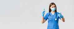 科维德防止病毒健康医疗保健工人检疫概念友好的女护士医生蓝色的呜个人保护设备眨眼保证使拍摄疫苗