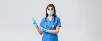 科维德防止病毒健康医疗保健工人检疫概念惊讶女护士医生蓝色的实习医生风云医疗面具手套指出左感兴趣