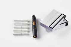 一代黑色的电子香烟包紫色的国加热棒孤立的白色高新技术加热烟草系统关闭
