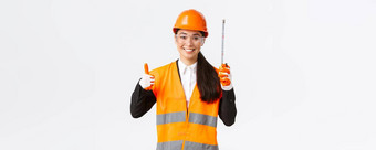 微笑自信女亚洲建设工程师架构师安全头盔统一的显示磁带测量竖起大拇指满意好结果住团队白色背景
