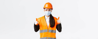 科维德安全协议<strong>企业建设</strong>防止病毒概念自信女亚洲工业工人工程师脸面具头盔显示竖起大拇指好